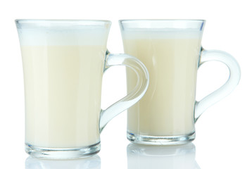 Cups of eggnog isolated on white