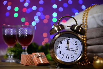 Wine glasses, retro alarm clock and Christmas decoration