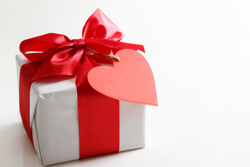 Gift box with red heart tag