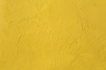 yellow textured wall. background