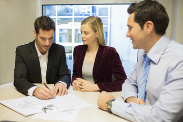 Couple signing real-estate contract