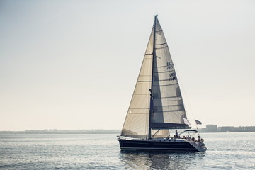 Sailing ship yachts with white sails