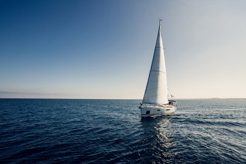 Sailing ship yachts with white sails