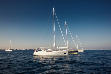 Sailing ship yachts with white sails