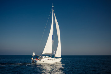 Fototapeta na wymiar Sailing ship yachts with white sails