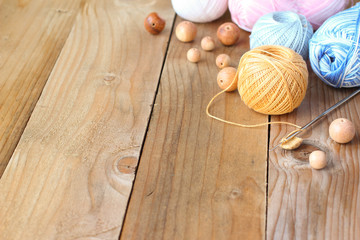 Materials for needlework on wooden table