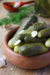 Salted Cucumbers in wooden bowl