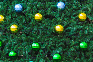 Star with colorful chrome ball elements on a Christmas tree