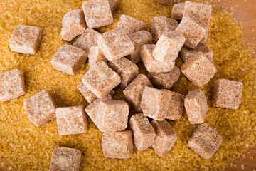 Brown cane sugar cubes and crystal sugar