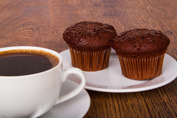 Cup of coffee with chocolate muffins