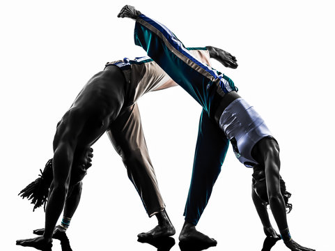 couple capoeira dancers dancing   silhouette