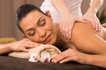 Obraz na płótnie Canvas Close-Up Of A Young Woman Receiving Back Massage At Spa