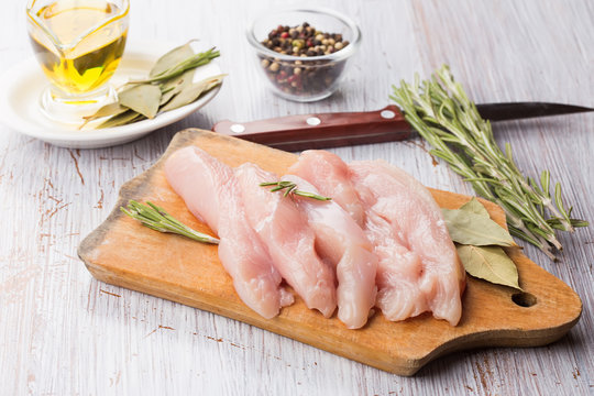 Fresh chicken on wooden table