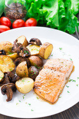 Roasted salmon with potatoes and mushrooms