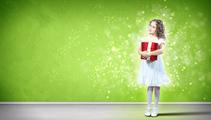 Happy girl opening gift box