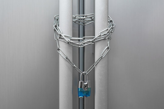 Dieting concept. Refrigerator, chain and lock