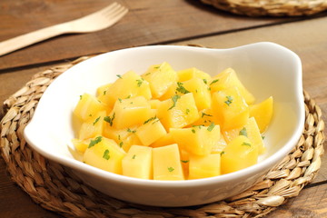 Steamed potato cubes with parsley and olive oil
