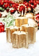 advent decoration with four burning candles and shiny lights