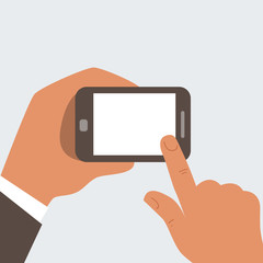Businessman touches mobile phone with blank screen