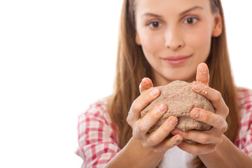 smiling woman chef holding dough in the hands