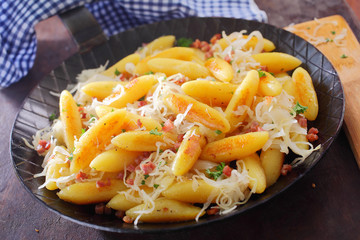 Finger-shaped potato dumplings and noodles