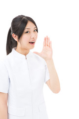 young asian nurse yelling on white background