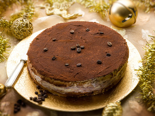 tiramisu over golden christmas table, selective focus