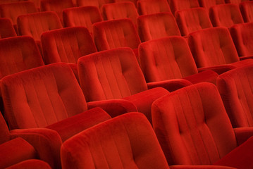 Red armchairs in theater