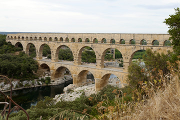 Fototapeta premium Scenic view of Roman built Pont du Gard aqueduct, Vers-Pont-du-G