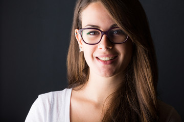 Fototapeta premium Pensive Young Woman on Dark Background