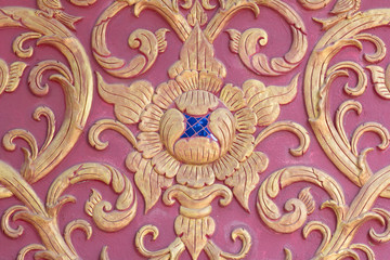 stucco wall burgundy color thai art