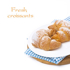 croissants on a wooden board, isolated