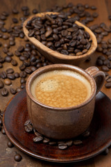 cup of espresso and coffee beans