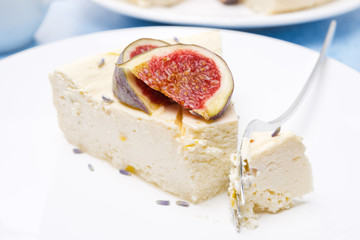 piese of cheesecake with honey and lavender and figs