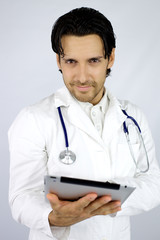 Smiling doctor with tablet