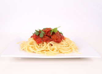 Pasta with meatballs decorated with coriander