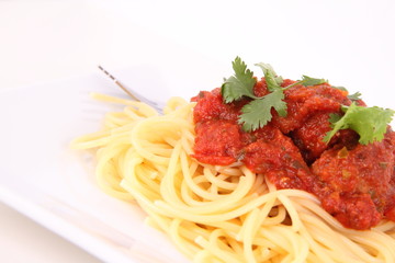 Pasta with meatballs decorated with coriander