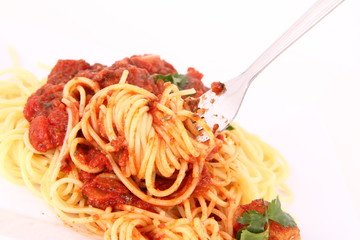 Pasta with meatballs decorated with coriander