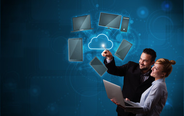 Happy couple touching cloud service