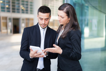 Business people using a tablet