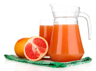 Full glass and jug of grapefruit juice and grapefruits isolated