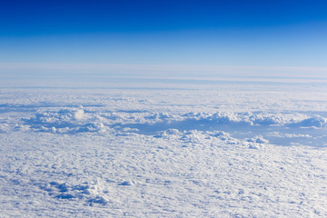 clouds. top view from the window of an airplane flying in the cl