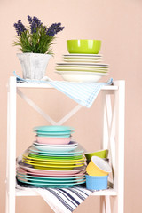 Beautiful white shelves with tableware and decor,