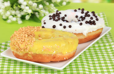 Sweet donuts on table close-up