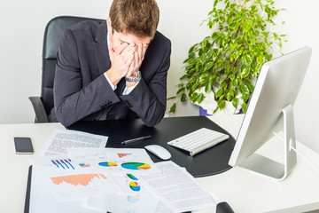 Stressed Young Businessman at Office