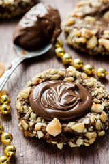 Chocolate filled cookies with hazelnuts, festive decorations