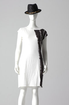 stylish dress with hat isolated on a mannequin