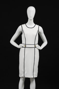 mannequin dressed in female clothes, isolated on black