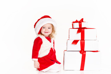 little girl in a cap of Santa Claus isolated on white background