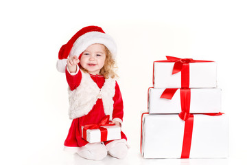 little girl in a cap of Santa Claus isolated on white background